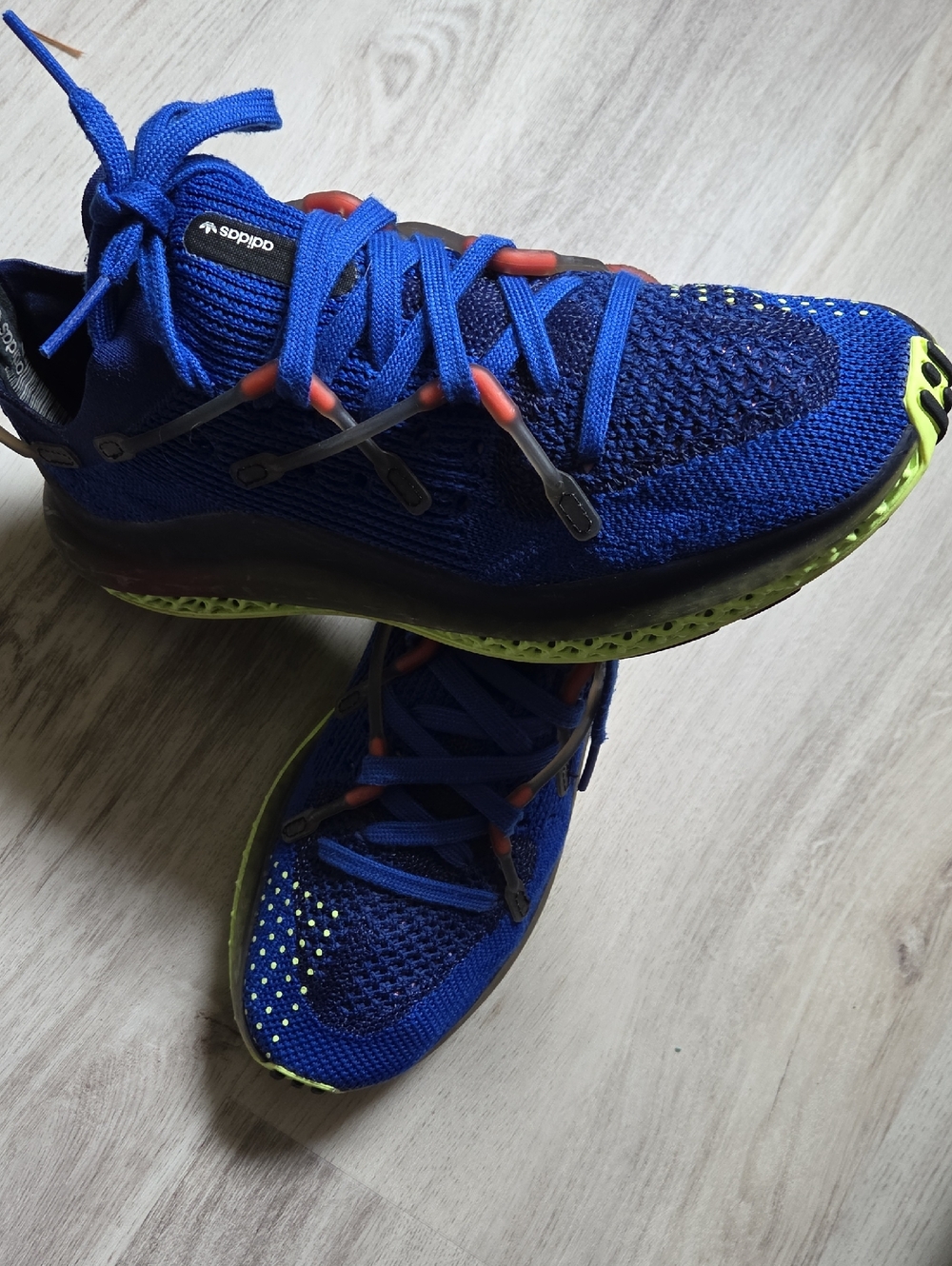 adidas Blue Knit Athletic Shoes with Neon Green Soles and Orange Accents